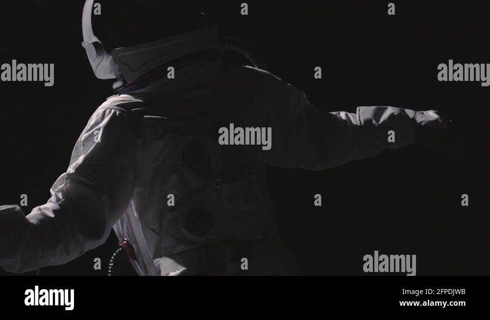An astronaut floats in space Stock Video Footage Alamy