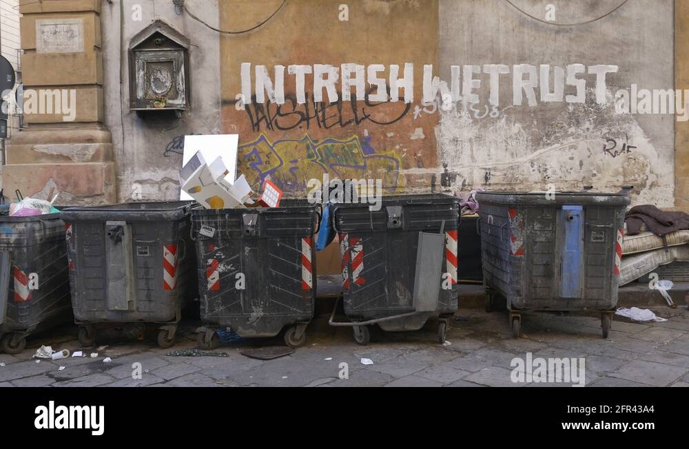 Trash cans on the streets of Palermo, Sicily, Italy. Trash thrown in