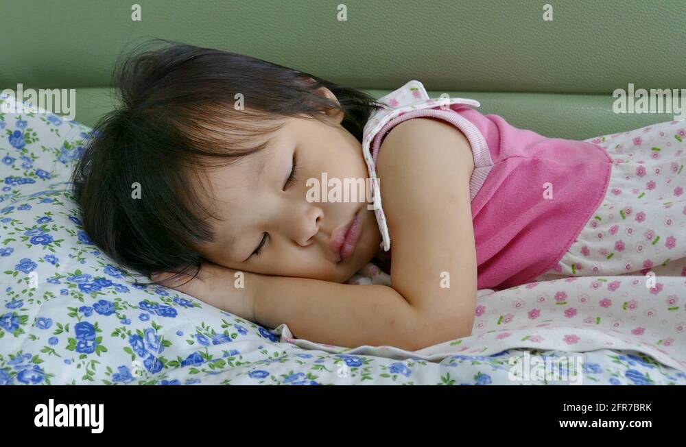 little girl sleeping on bed Stock Video Footage - Alamy