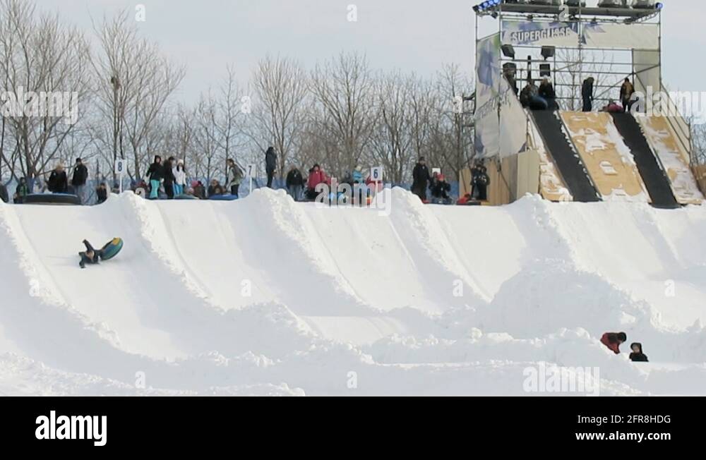Children snowtubing in Montreal, Quebec, Canada Stock Video Footage Alamy