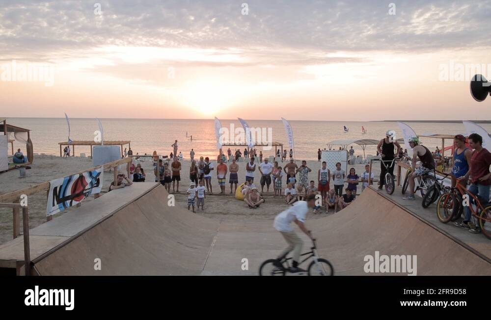 Bmx Rider Making a Bike Tricks in a ramp During competition. Bmx-vert ...