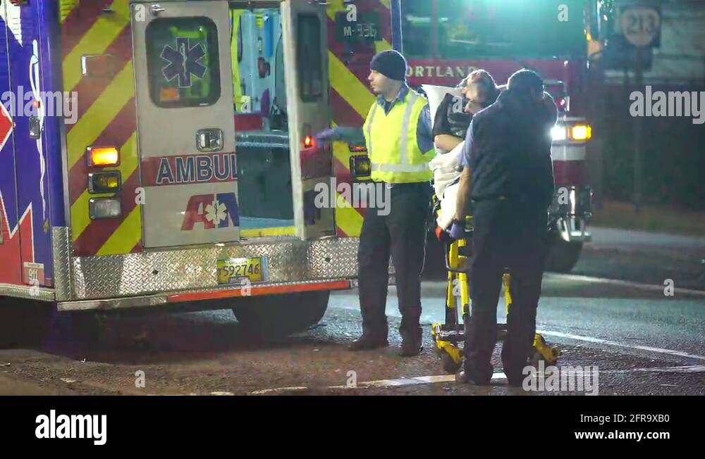 Medics Loading A Person Into An Ambulance After A Car Crash Stock Video ...