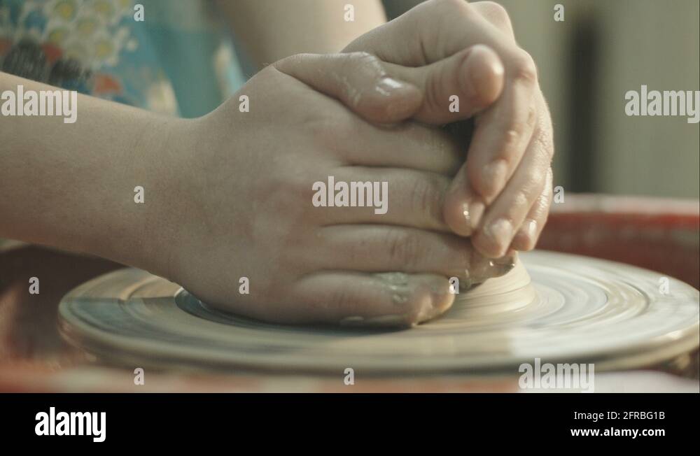Pottery Craft Wheel Ceramic Clay Potter Human Child Hands. RAW video