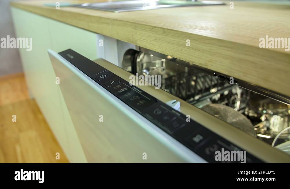 Adjusting the settings on a half open dishwasher Stock Video Footage