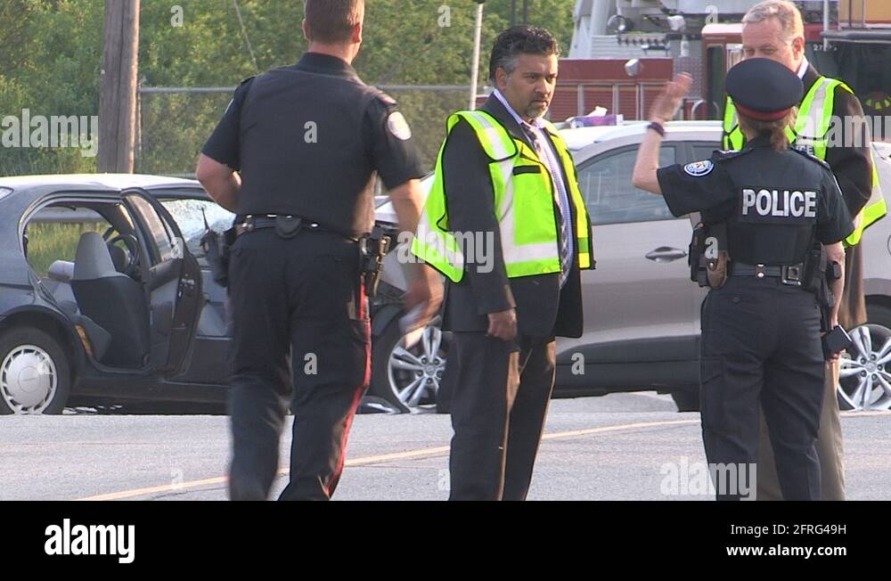 Deadly fatal head on car crash in city of Toronto intersection Stock