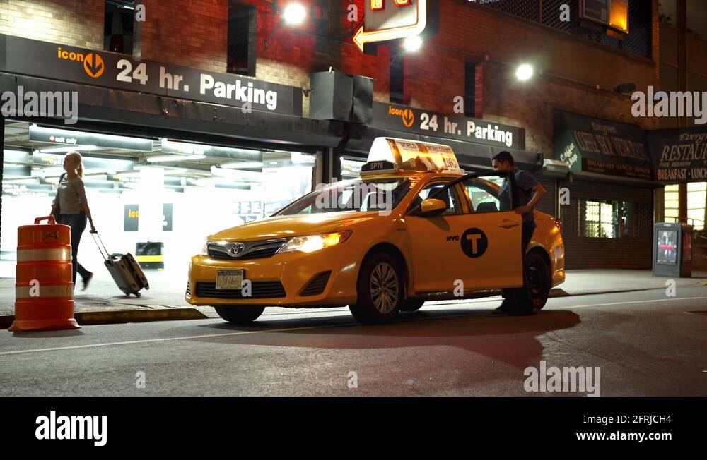 Taxi stopped in front of parking garage in New York City 4k Stock Video