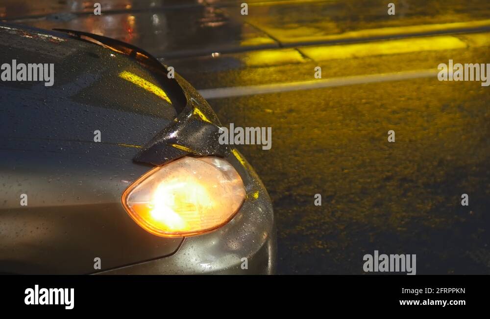 Parked car on rainy night. Hazard lights flashing Stock Video Footage Alamy