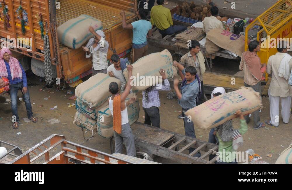 Manual labour with unloading jute spice bags from truck,New Delhi,India