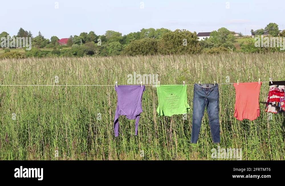 Clothesline with Clothes Drying Outside and Grass Field in Ireland