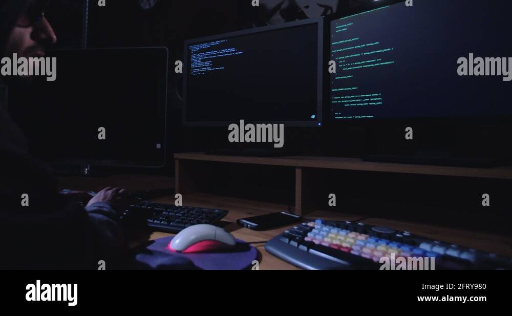 Cyber terror - computer hacker in a dark room Stock Video Footage - Alamy