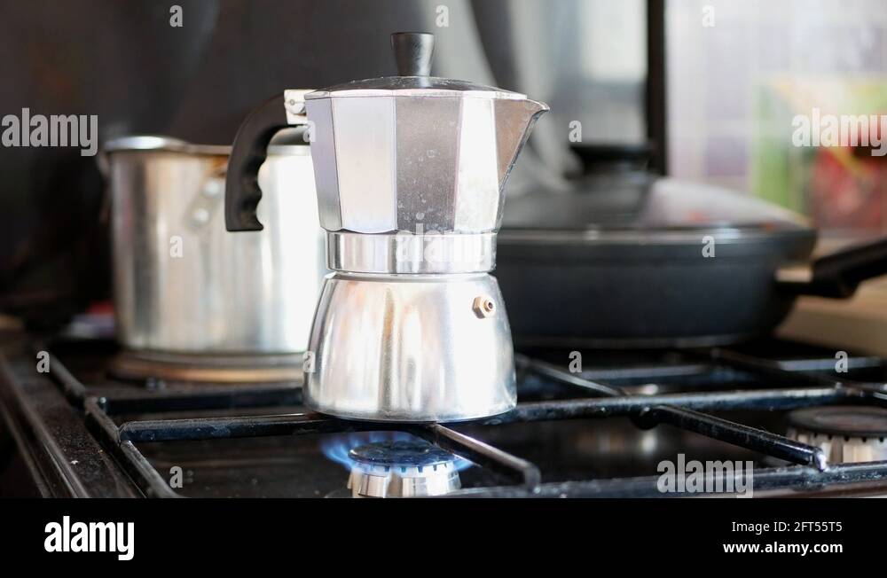 Moka pot coffee maker on a gas cooking hob Stock Video Footage Alamy