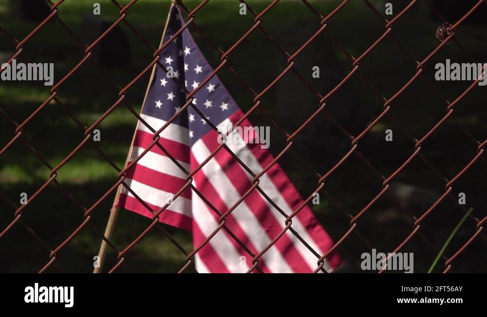 American flag waving behind chain link fence 4k Stock Video Footage - Alamy