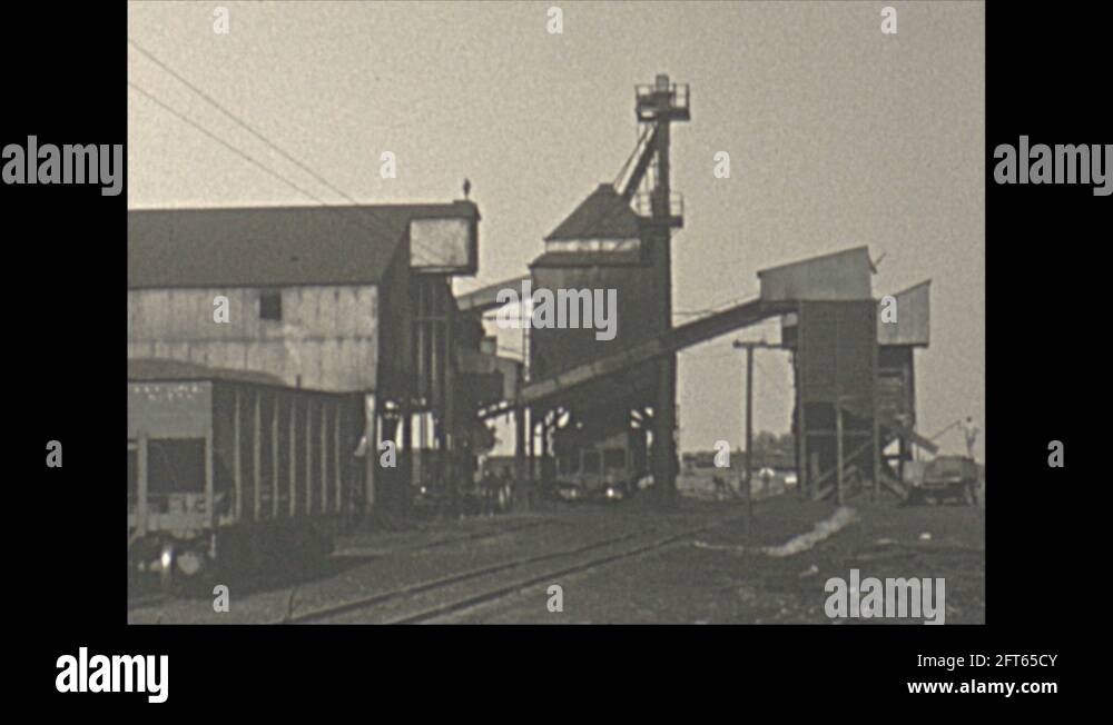 Vintage 16mm film, 1940 Illinois, coal mine rail car pushed down the