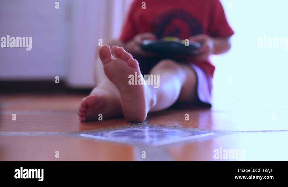 Kid foot on floor Stock Videos & Footage - HD and 4K Video Clips - Alamy
