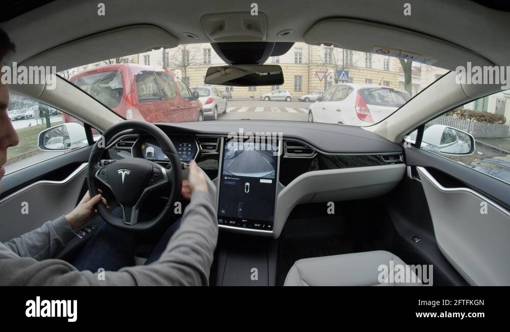 POV Fully autonomous selfdriving Tesla car selfparking when near a