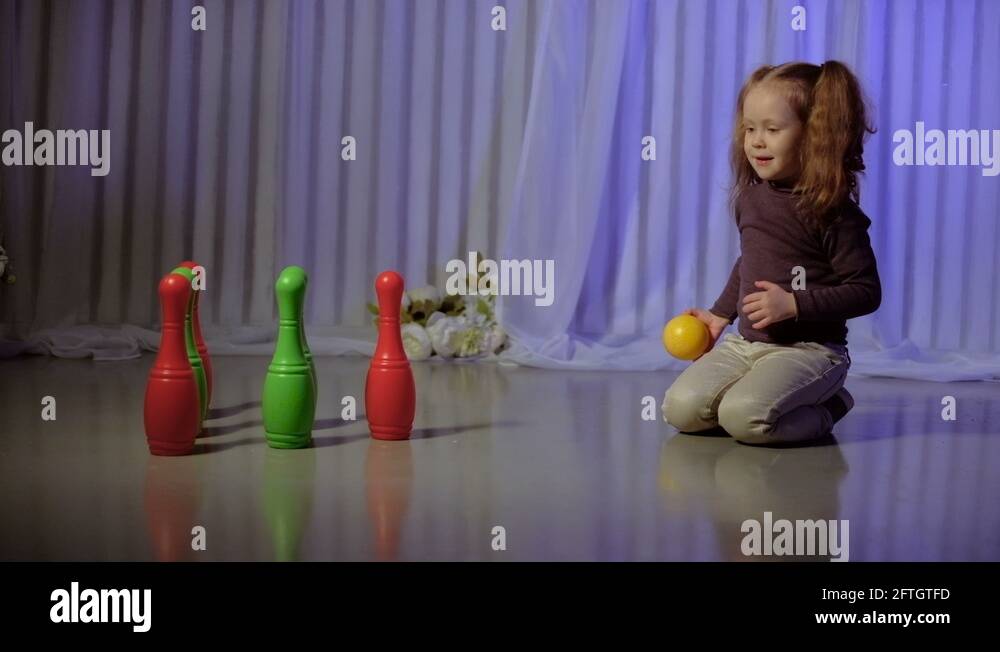 Little girl playing bowling Stock Video Footage Alamy