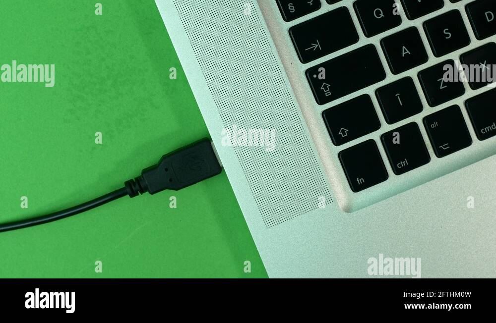 Hand Removing Usb Cable From Laptop, Green Screen, Detail, High Angle