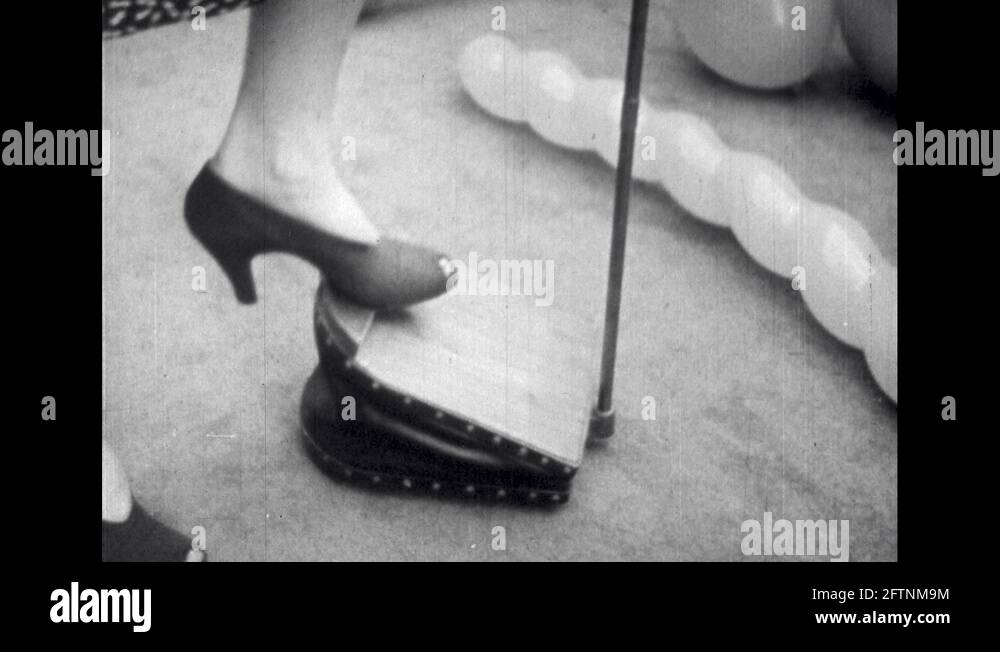 1960s Lady Using Foot Pump to Fill Balloon Stock Video Footage Alamy