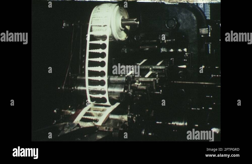 UNITED STATES 1950s printing press moves. Man supervises printing