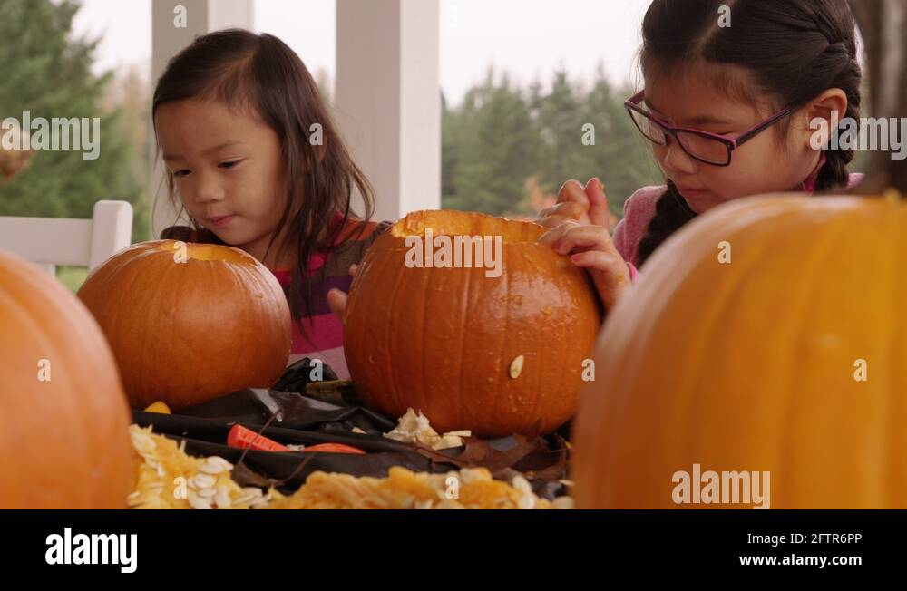 Kids carving pumpkins for Halloween Stock Video Footage - Alamy