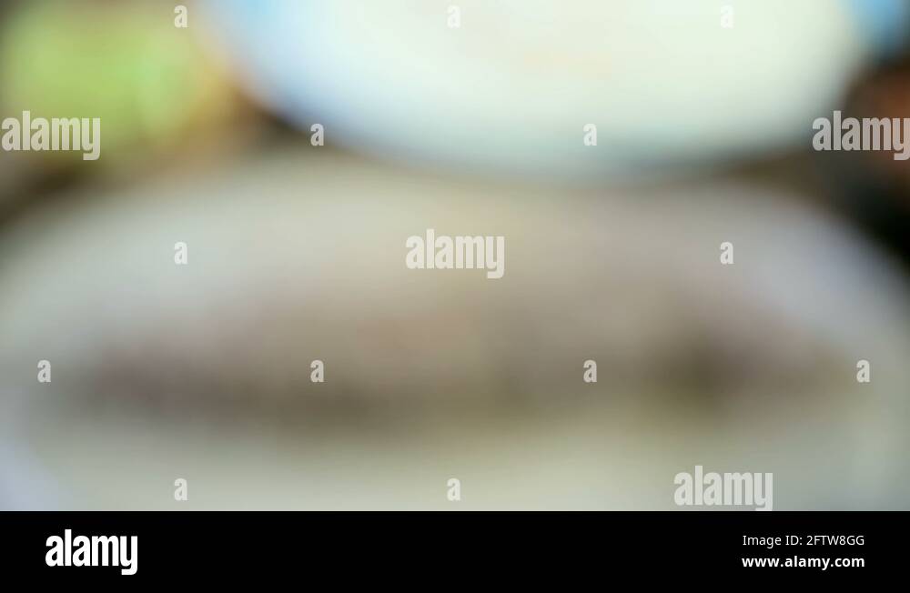 Slicing beef flank steak for steak fajitas on a wood cutting board