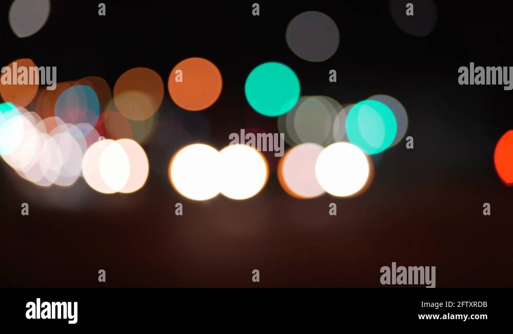 How To Shoot Bokeh Video City street bokeh lights moving in the distance for green screen Stock
