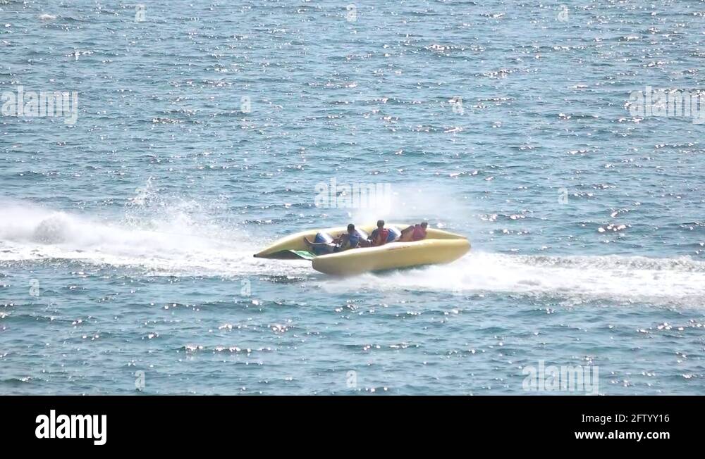 Flying banana boat, jet ski Stock Video Footage Alamy