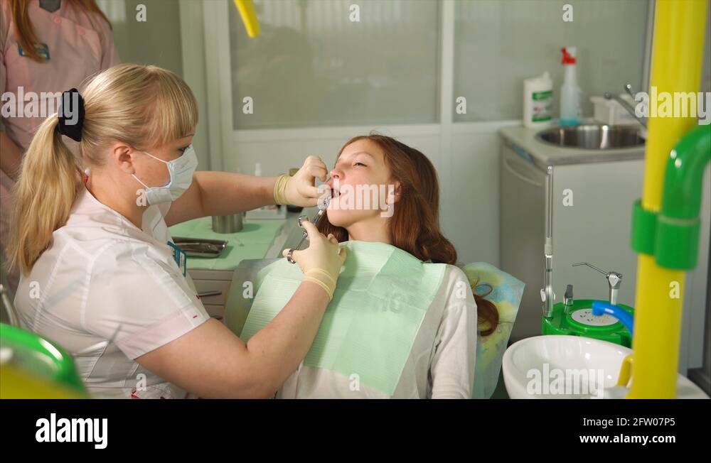 Anesthetic injection in dental Female dentist doing injection