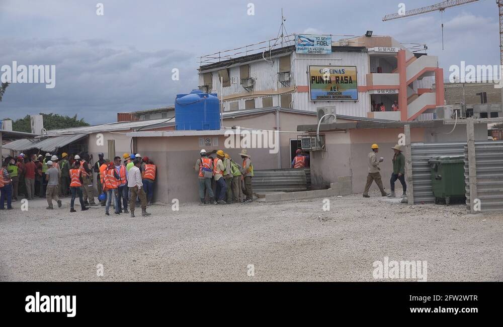 Construction workers at site new hotel resort, manual labor development in Cuba Stock Video