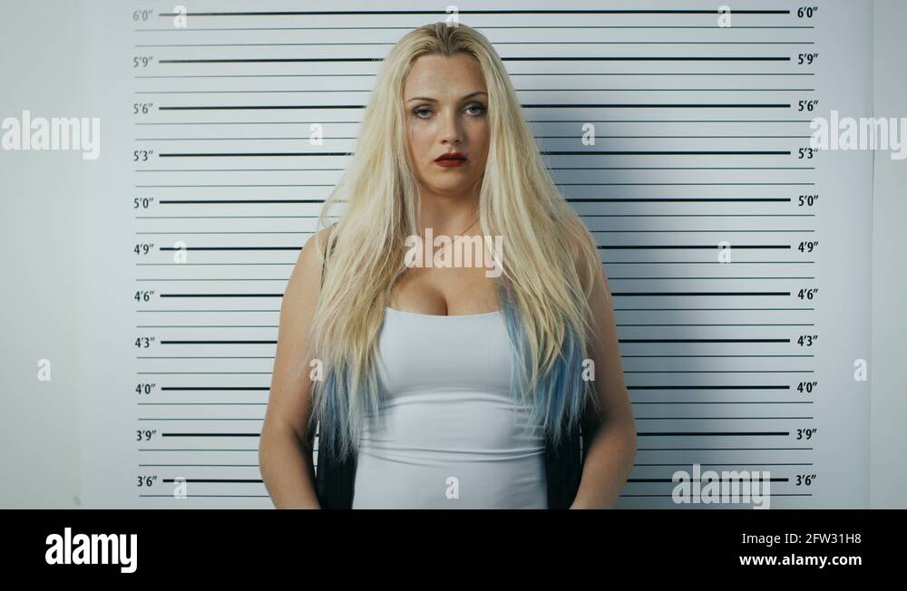 In A Police Station Arrested Woman Posing For Side Front View Mugshot Stock Video Footage Alamy In A Police Station Arrested Woman Posing For Side Front View Mugshot Stock Video Footage Alamy