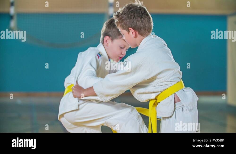 Two boys with yellow belts are fighting Stock Video Footage Alamy