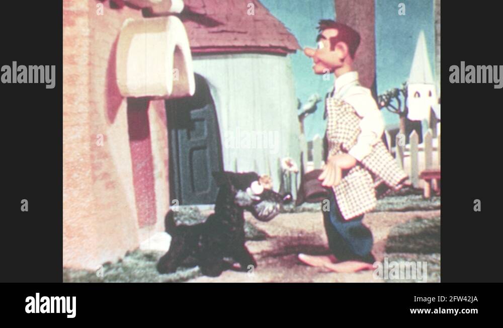 1950s puppet pets dog, walks away. Puppet walks into house, dog Stock Video Footage