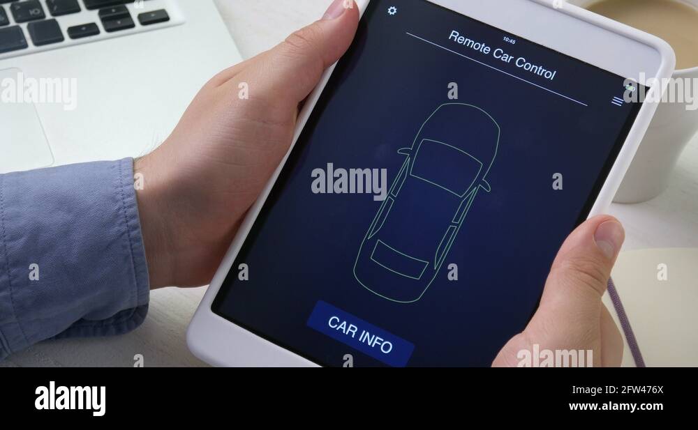 Man checks car information on his digital tablet, the car is in good