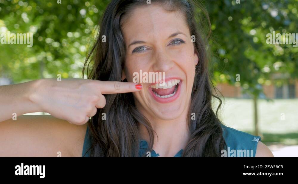Beautiful woman pointing teeth Stock Videos & Footage HD and 4K Video