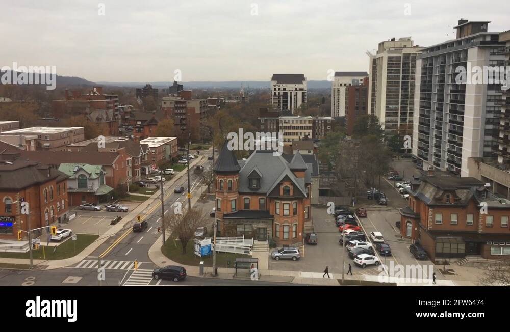 Pan of Hamilton city's architecture, apartment buildings, busy streets