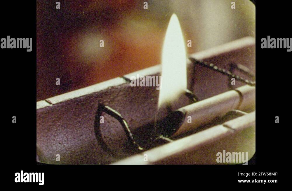 1950s: A flame burning strings, dropping weights off the back of a ...