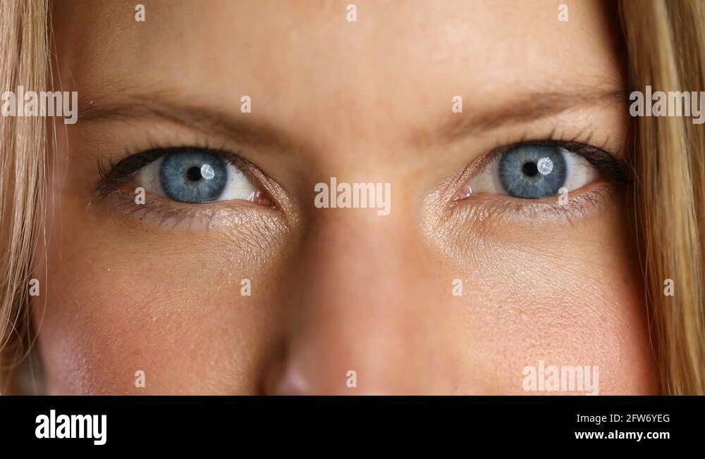 Blinking blue eyes Stock Video Footage Alamy