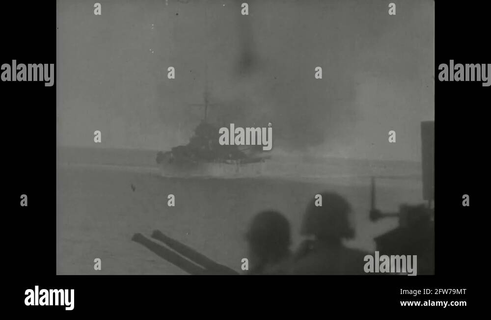 Ship bombards one another, soldiers debark and go ashore 1944 Stock