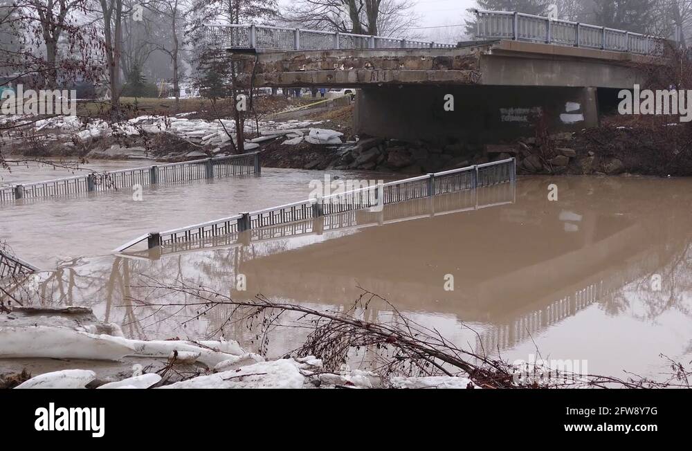 Bridge collapses into river during severe storm and flash flooding