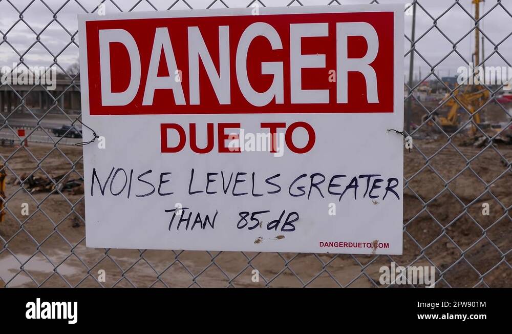 Loud noise warning signs at construction site Stock Video Footage Alamy