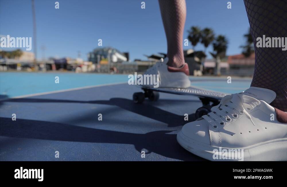 Skateboard with its wheels spinning. Slow motion 4k Stock Video Footage