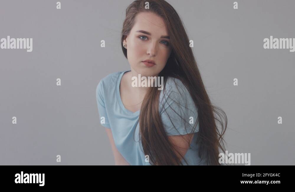 young baby face model in studio. Long straight hair blue eyed model ...