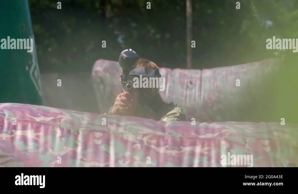 Paintball player shooting target HD game slowmotion POV video. Hit camera Stock Video Footage