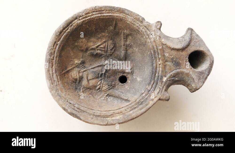 Authentic ancient Roman Greek Clay olive oil lamp depicting warriors