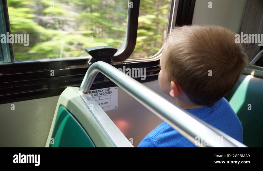 Cute little boy riding the public city bus with his family Stock Video ...