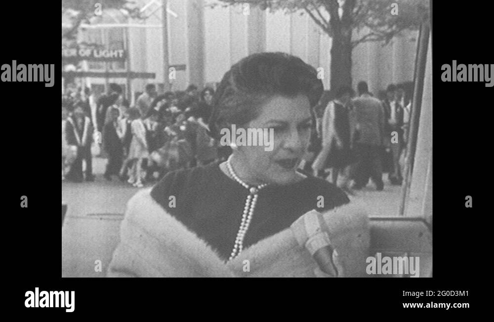 1960s: Women Sit And Speak Into Microphone. People And Tram Pass Stock ...