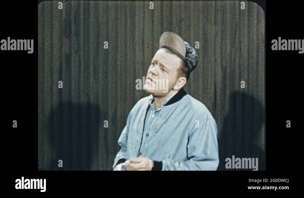 1950s Men smoking. Metal rods move through machines. Man measures