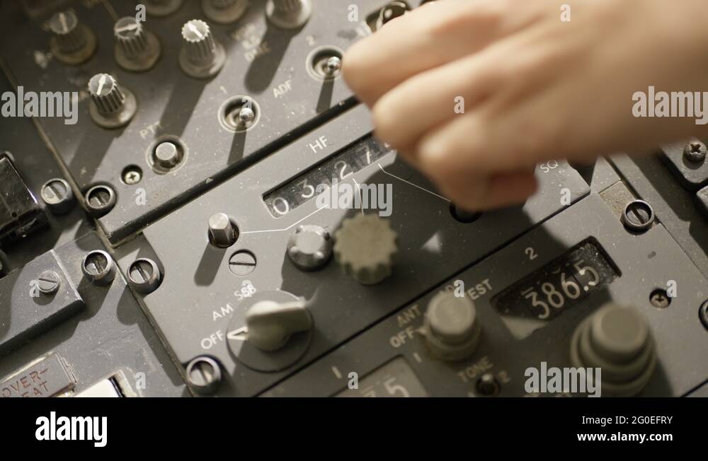 Hand twists a knob to adjust numbers on cockpit display Stock Video ...