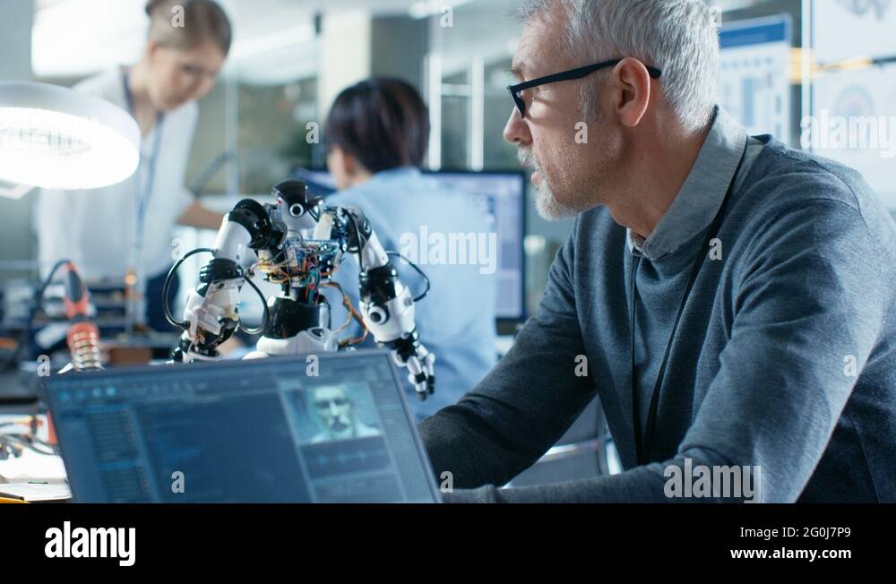 Senior Robotics Engineer Manipulates Voice Controlled Robot Stock Video