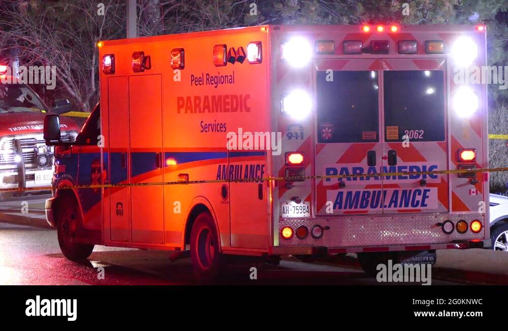Emergency medical ambulance with flashing lights on at incident scene Stock Video Footage Alamy